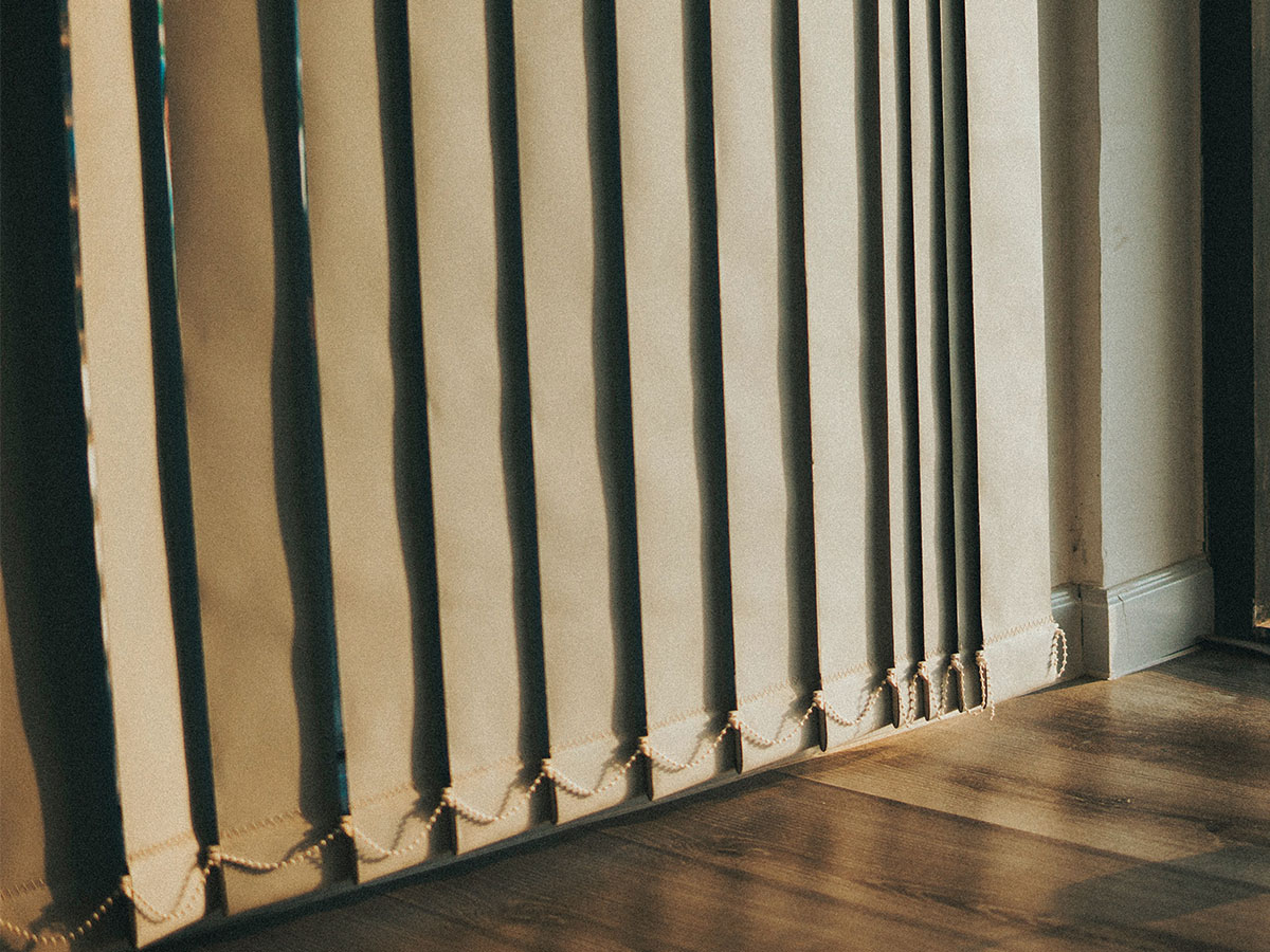 vertical blinds against the wall